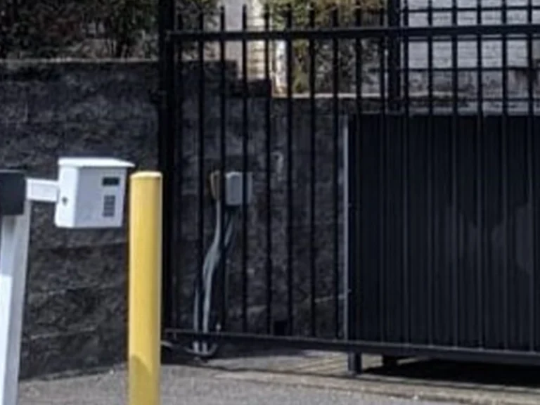 Modern access gate installed by Everlast Gates & Fence in a Wylie residential neighborhood