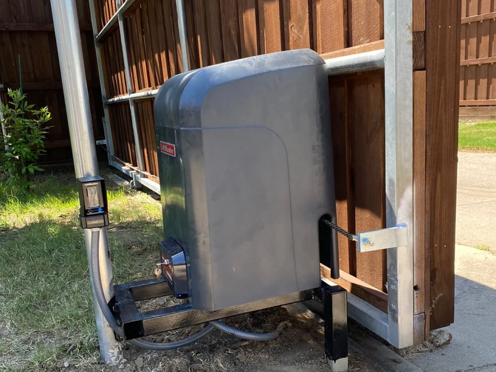 Automatic gate repair service in Wylie, TX with a technician inspecting a malfunctioning gate