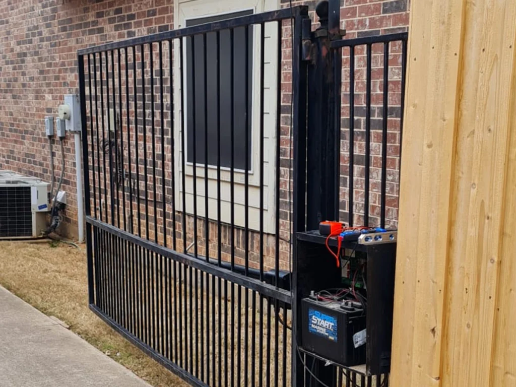 Technician performing automatic gate repairs in Wylie, TX
