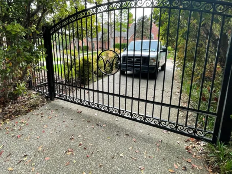 Professional technician installing a call entry gate system in Plano, Texas