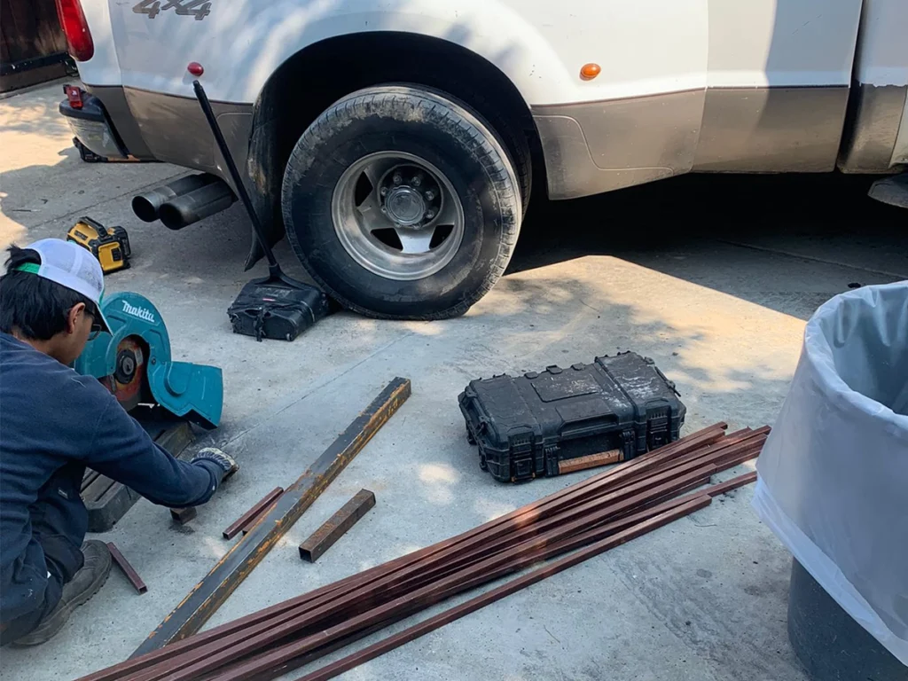 Technician performing routine commercial gate maintenance in Wylie, TX