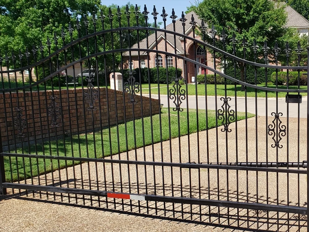 Modern custom driveway gate installed at a residential home in San Antonio by Everlast Gates & Fence
