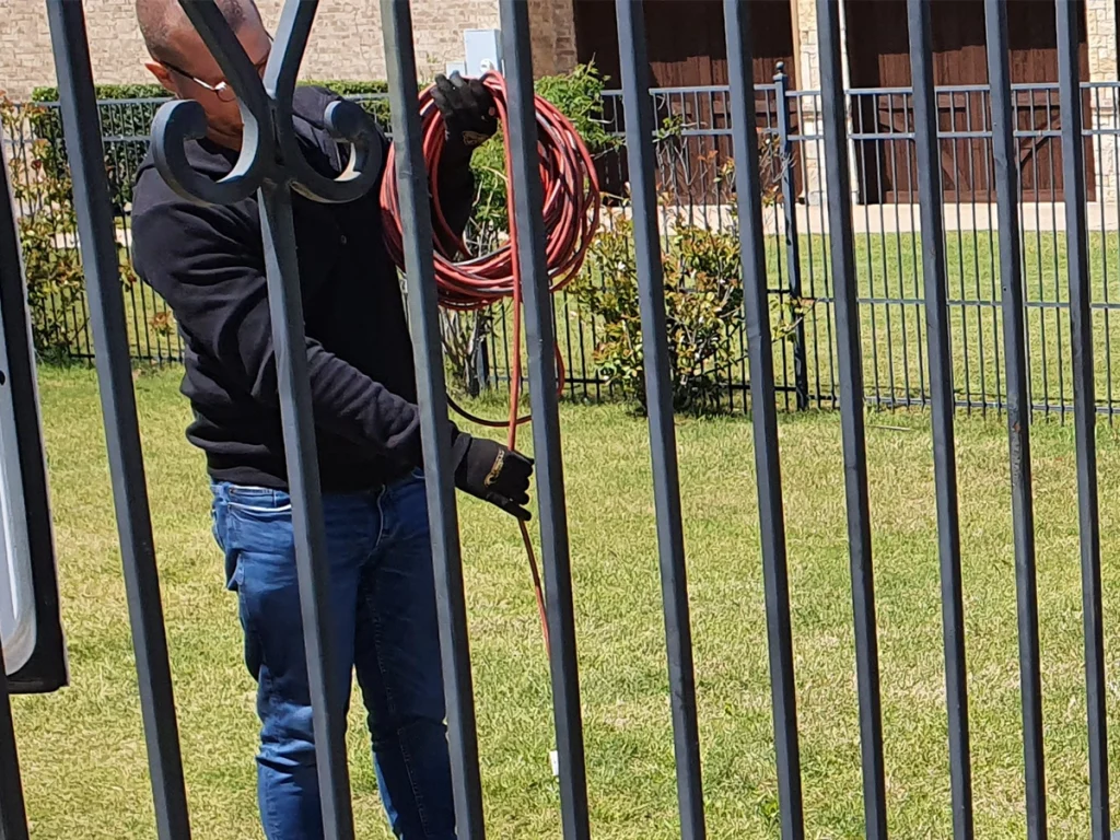 Elegant custom iron fence installation in front of a modern home in Plano, TX