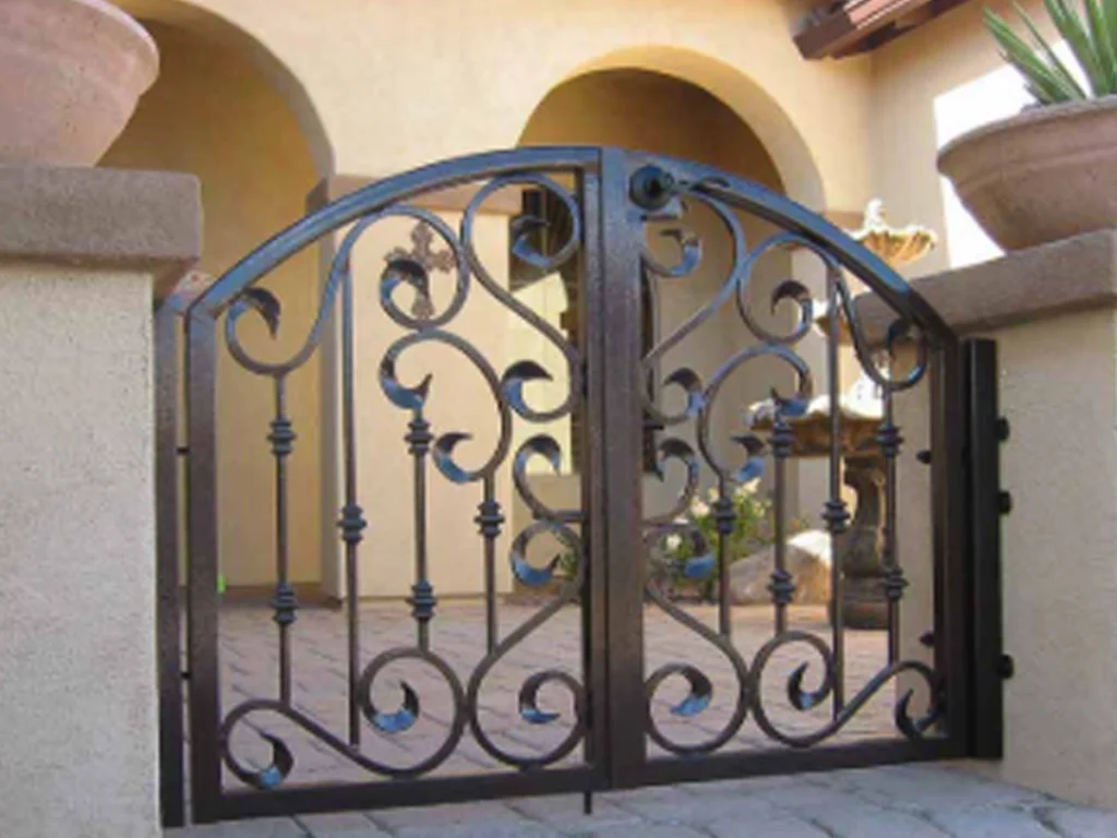 Custom Iron Gate Frisco home entrance with a bold iron driveway gate