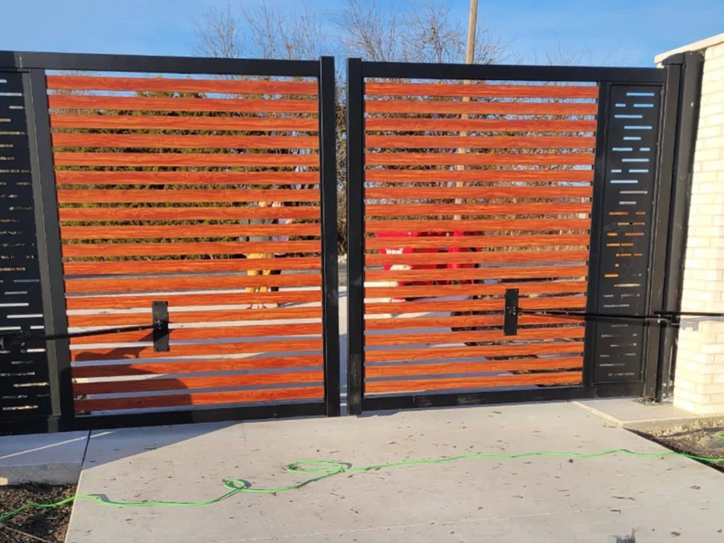 Custom swing gates in Houston blending elegance and security installed by Everlast Gates & Fence