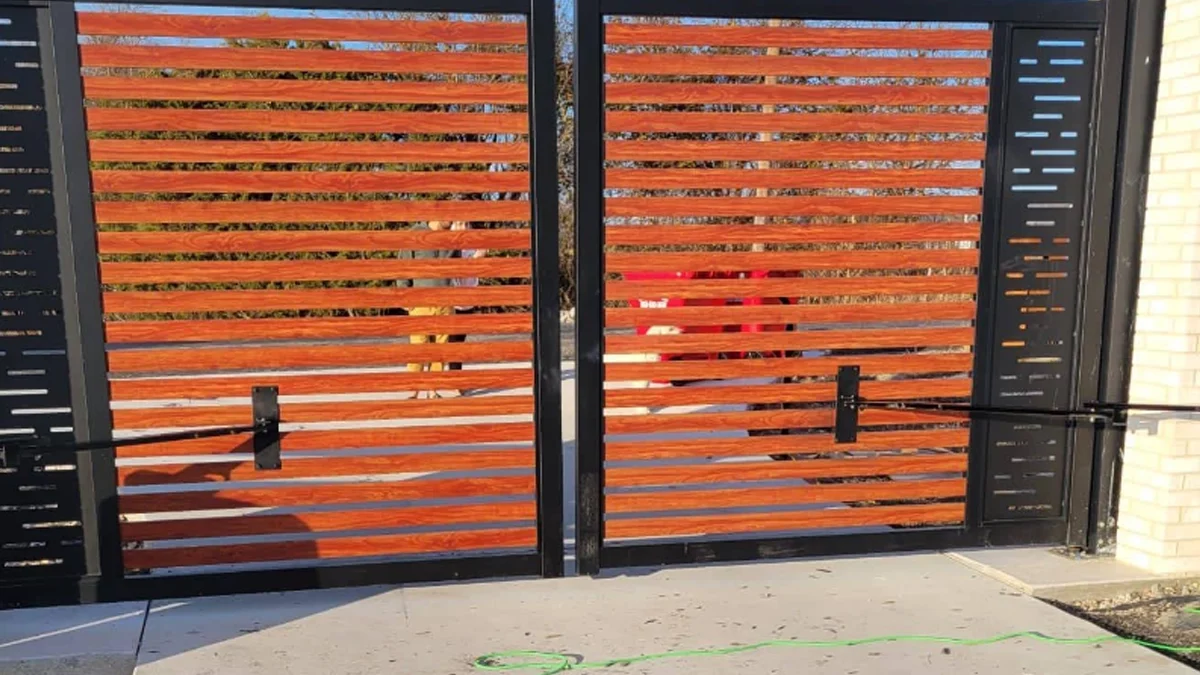Custom swing gates in Houston blending elegance and security installed by Everlast Gates & Fence