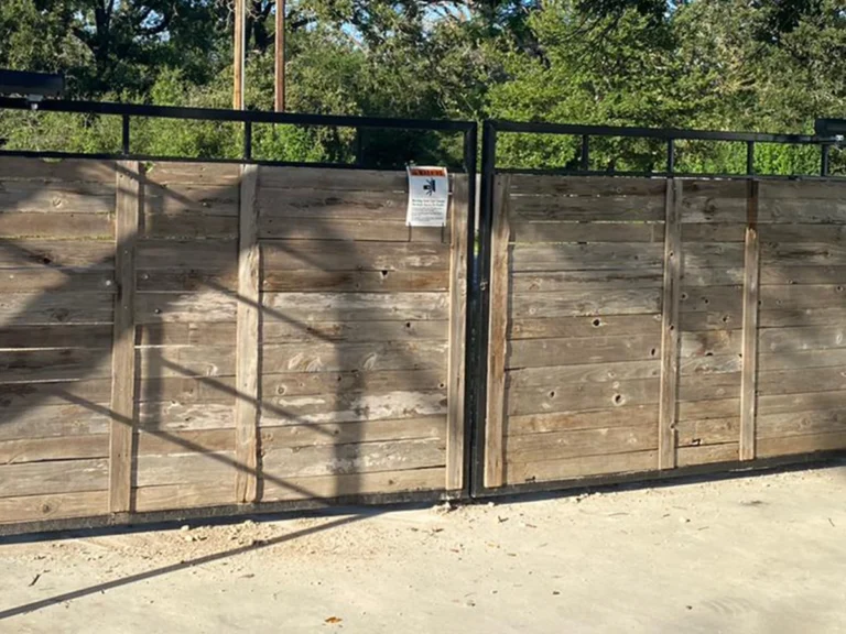 Custom wood gate installation by Everlast Gates & Fence in San Antonio, TX