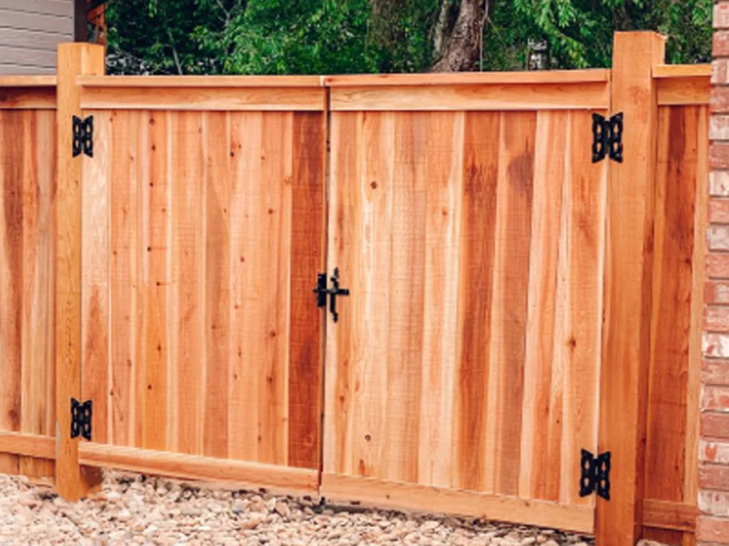 Custom wood gates San Antonio suburban home with warm cedar privacy