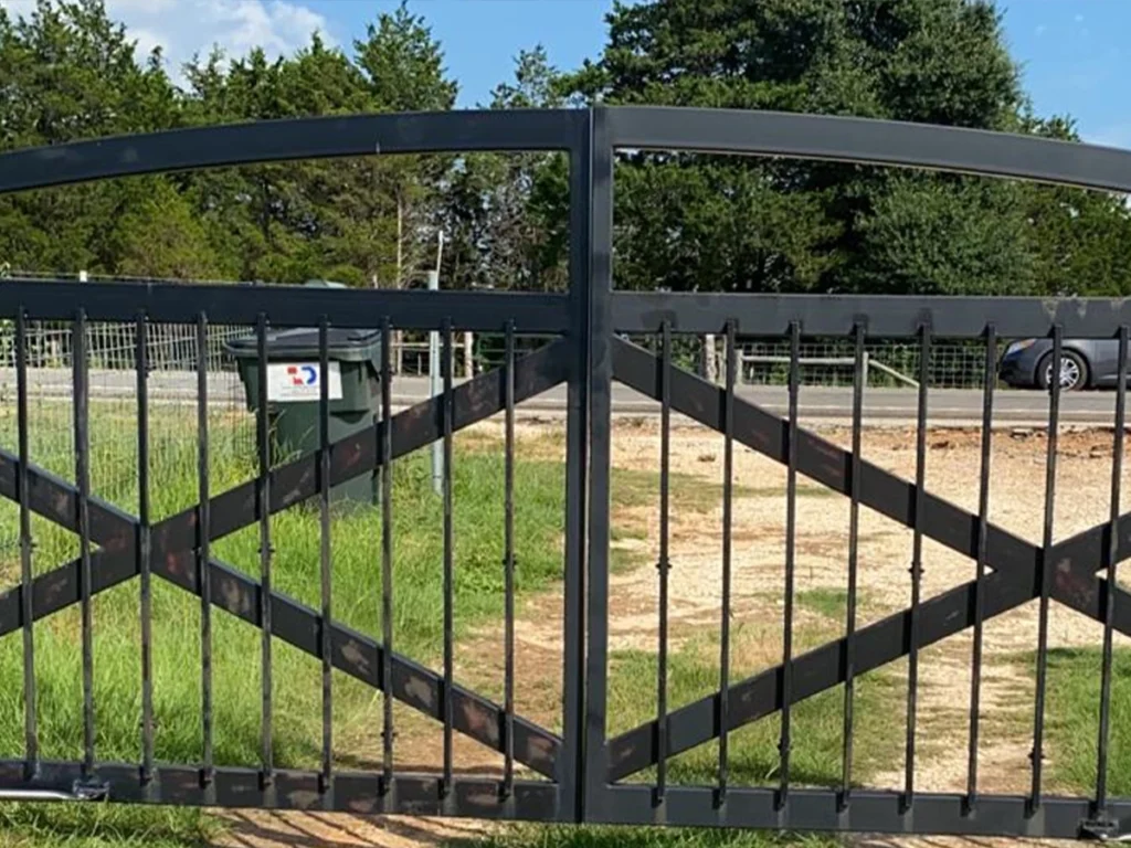 Technician installing a driveway automatic gate in Farmers Branch