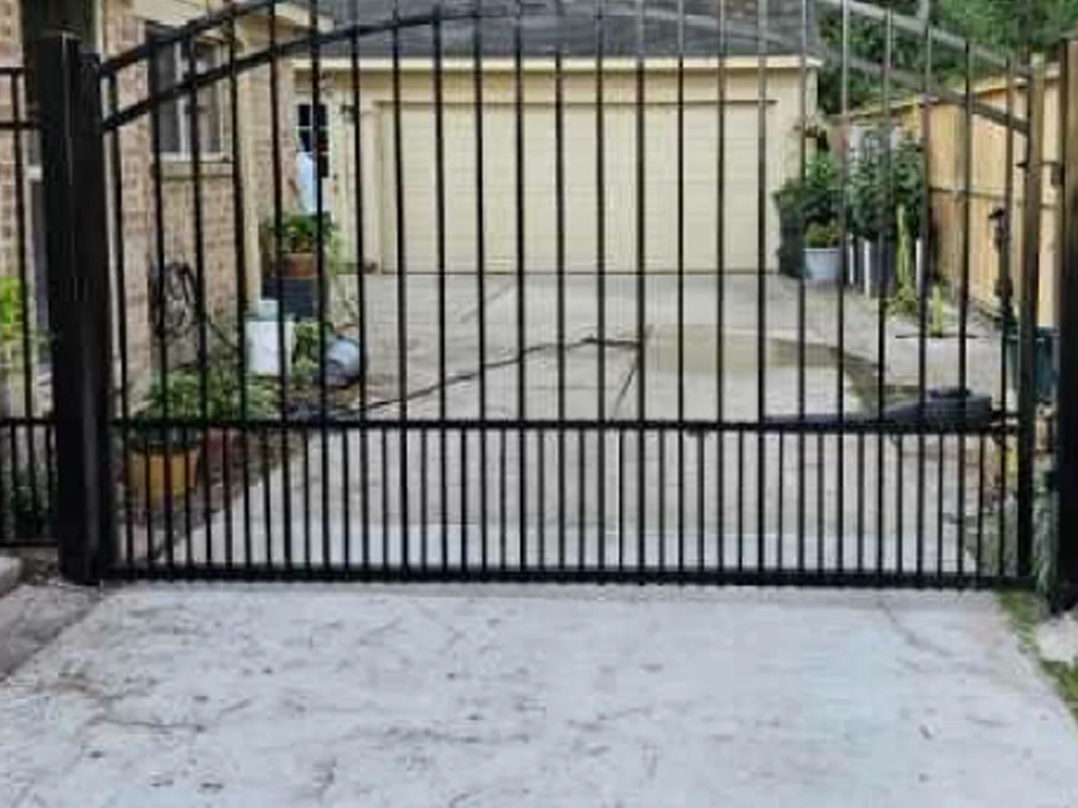 Driveway Gate Installation in Garland, TX at a modern home entrance