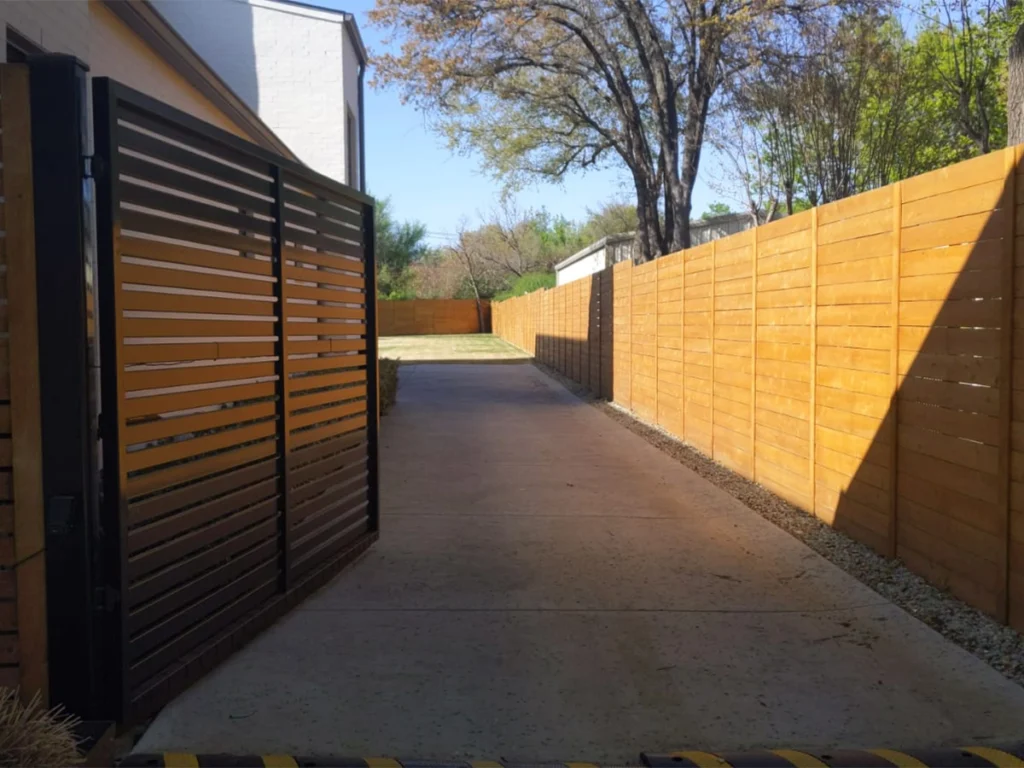 A modern driveway gate providing enhanced security for a family home in Frisco, TX.