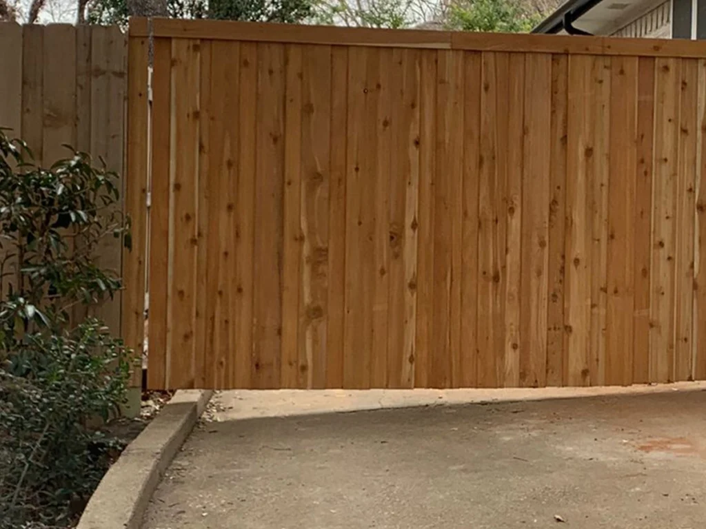 Custom durable wood gate installed in a Farmers Branch neighborhood by Everlast Gates & Fence