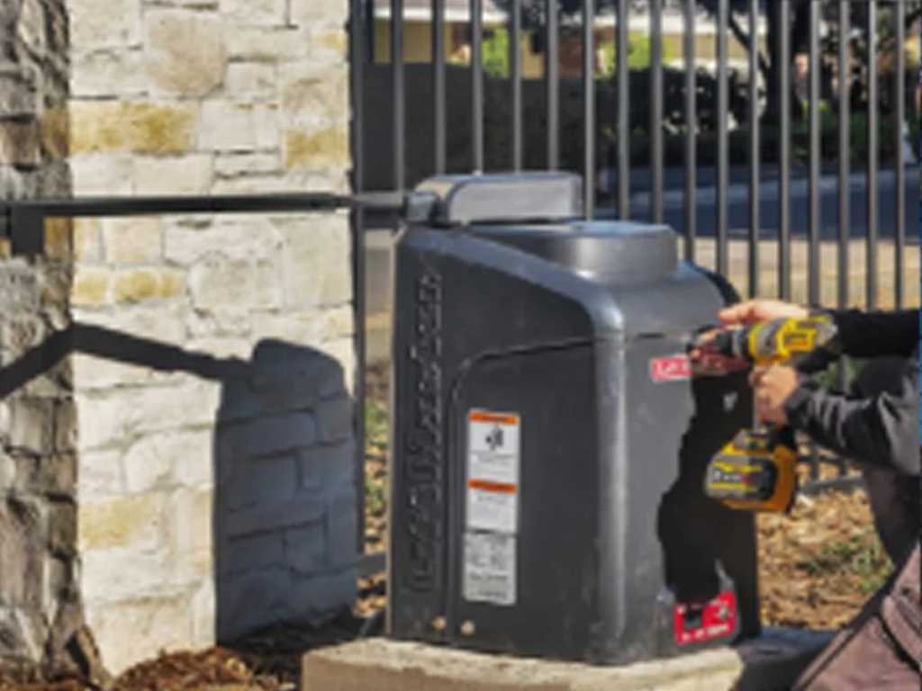 Gate Diagnostics Richardson technician testing a commercial gate operator