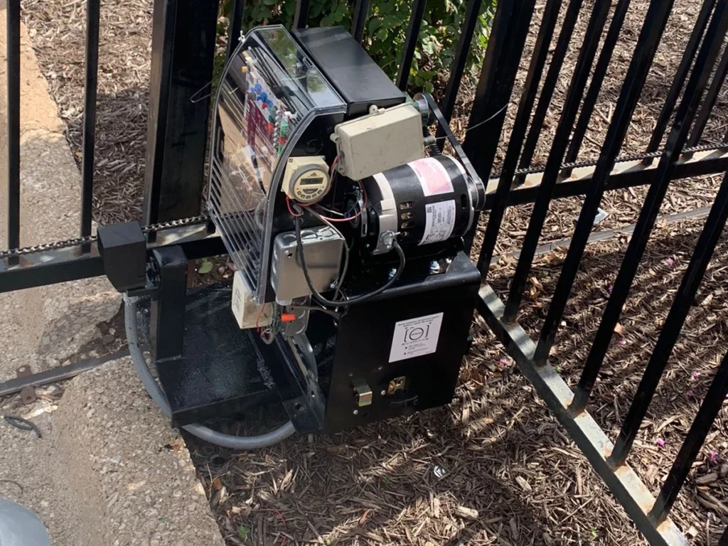 Technician performing electric gate repair in Carrollton, TX