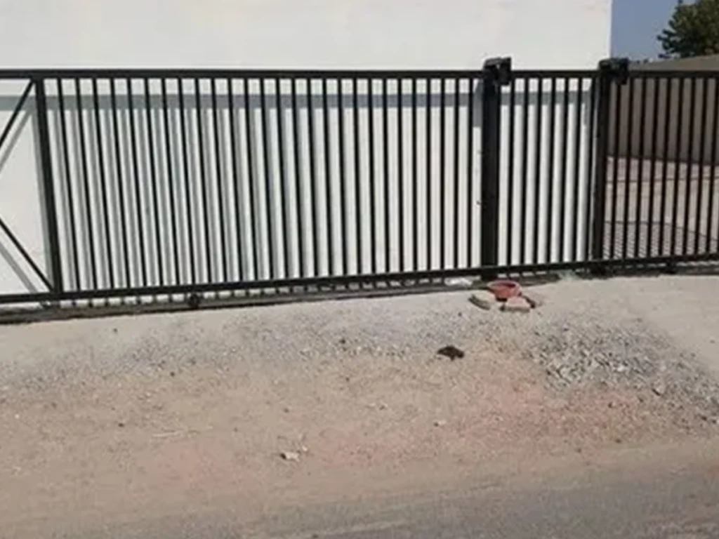 Sliding gate repair in progress by Everlast Gates & Fence in Wylie, TX