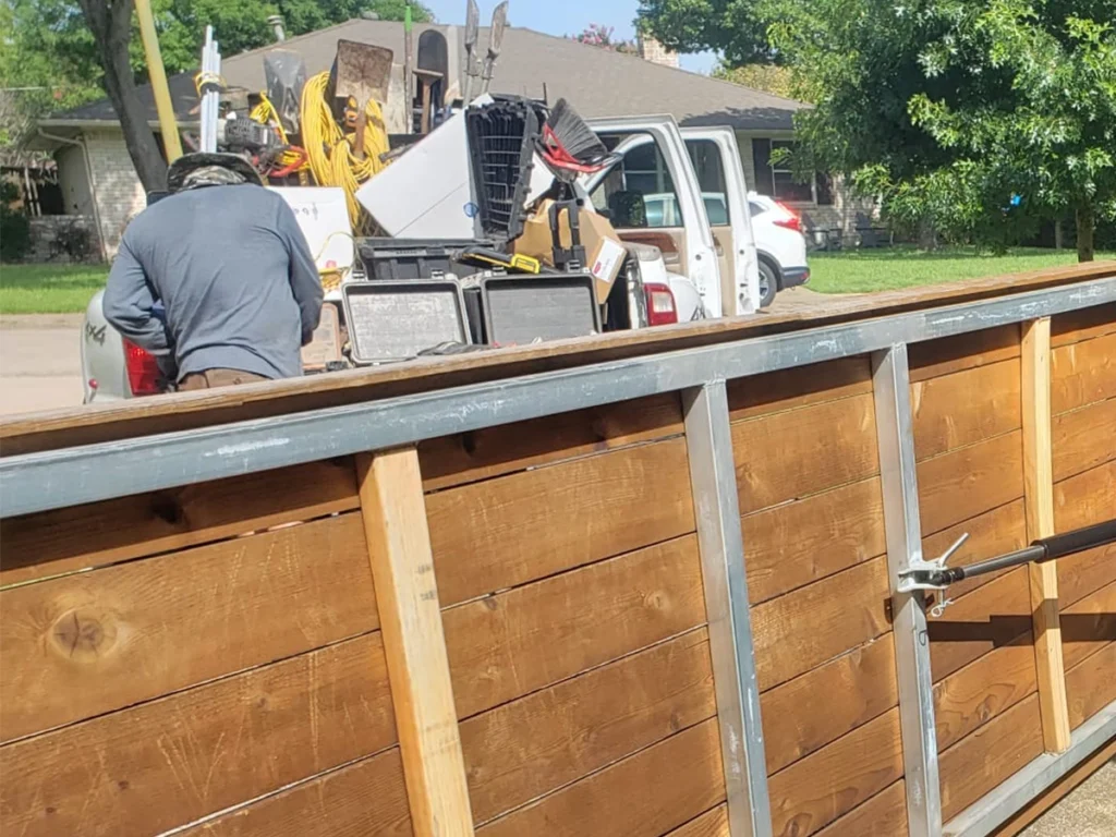 Wooden driveway gate installation in a Richardson, TX home by Everlast Gates & Fence