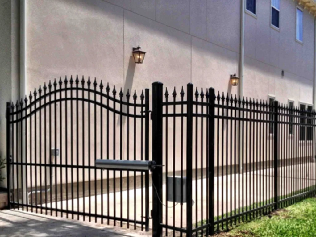 Fence gates access in Houston property with secure entry controls and strong metal construction