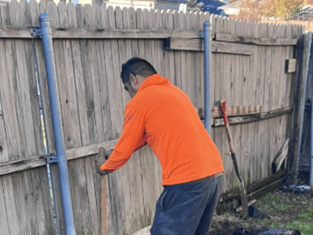 Fence Repair Wylie team fixing a damaged fence for better property security