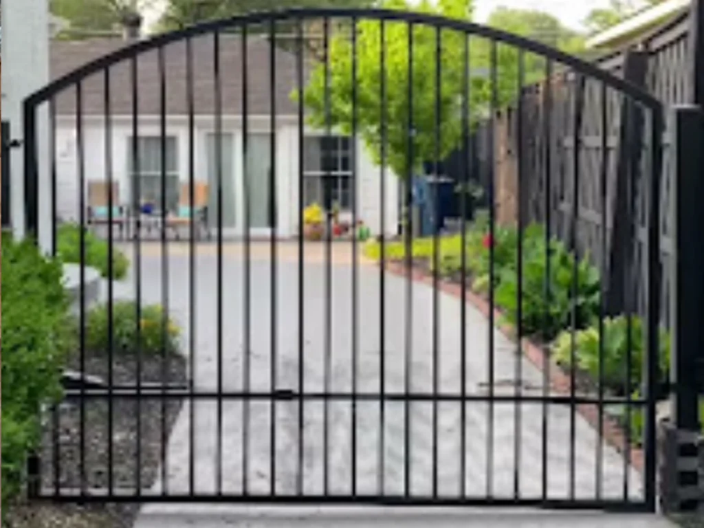 Modern driveway gate installation in Houston enhancing home privacy, security, and value.