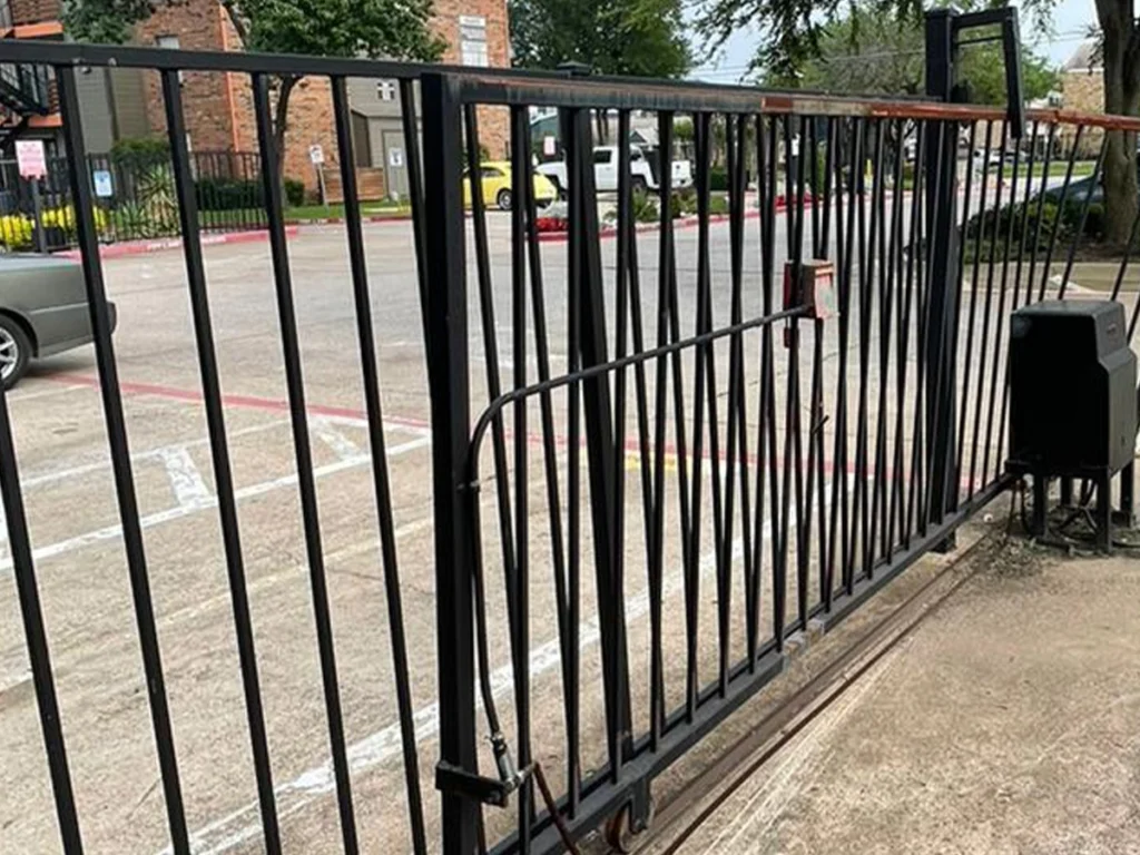 Elegant iron fence enhancing a Wylie, TX property’s curb appeal and security.