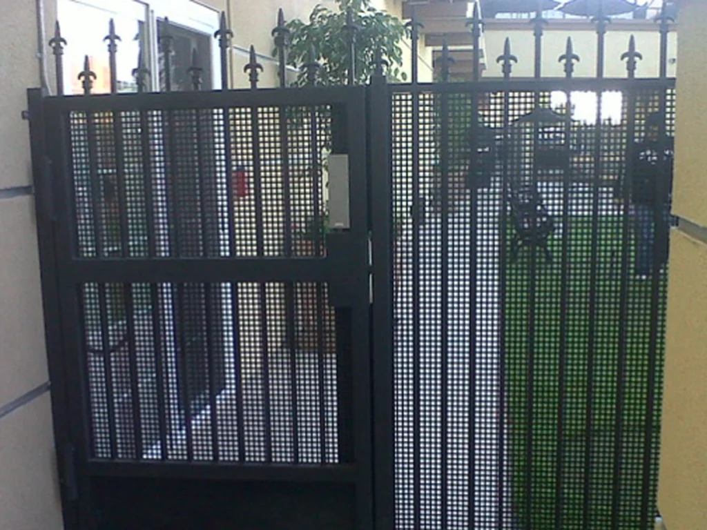 iron gate installation in Plano at a beautiful driveway entrance