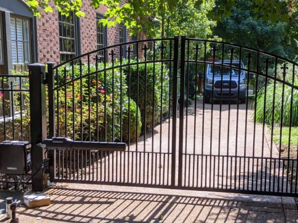 Driveway gate design matching Richardson home architecture