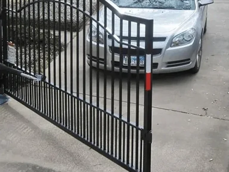 Technician installing modern call entry gate in Frisco by Everlast Gates & Fence