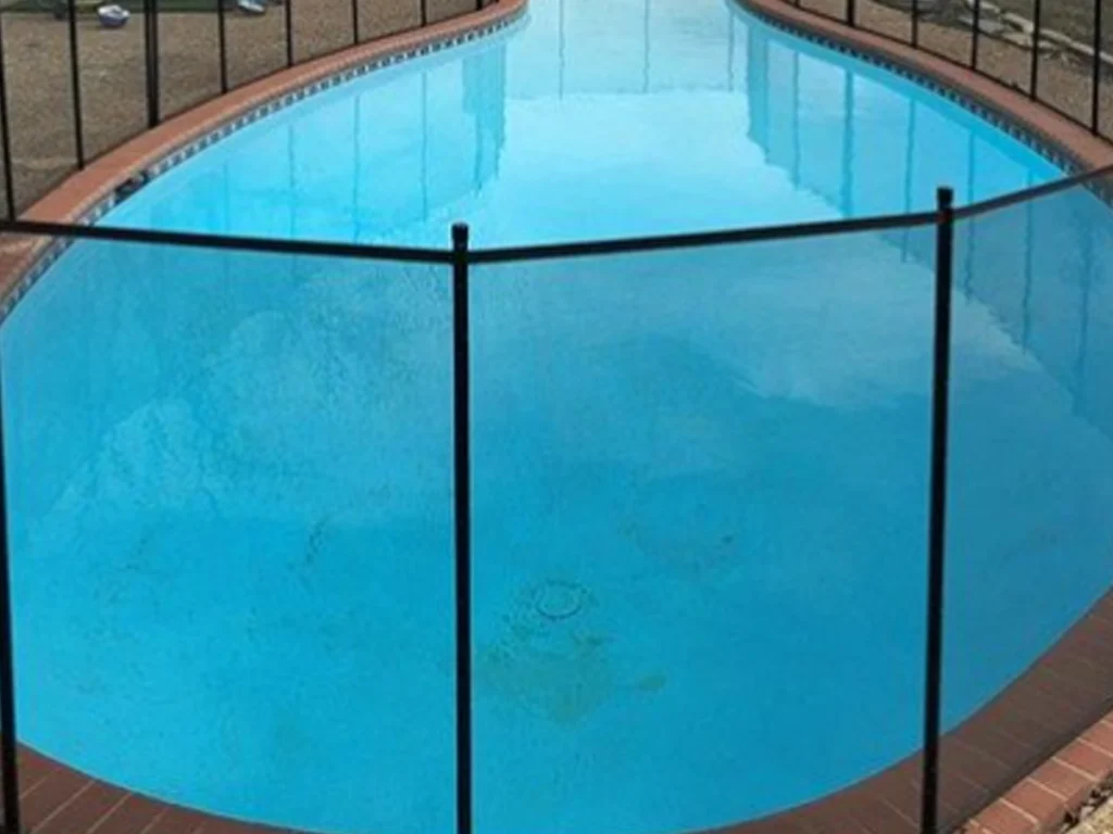 Modern pool fence trends in Richardson around a safe backyard pool