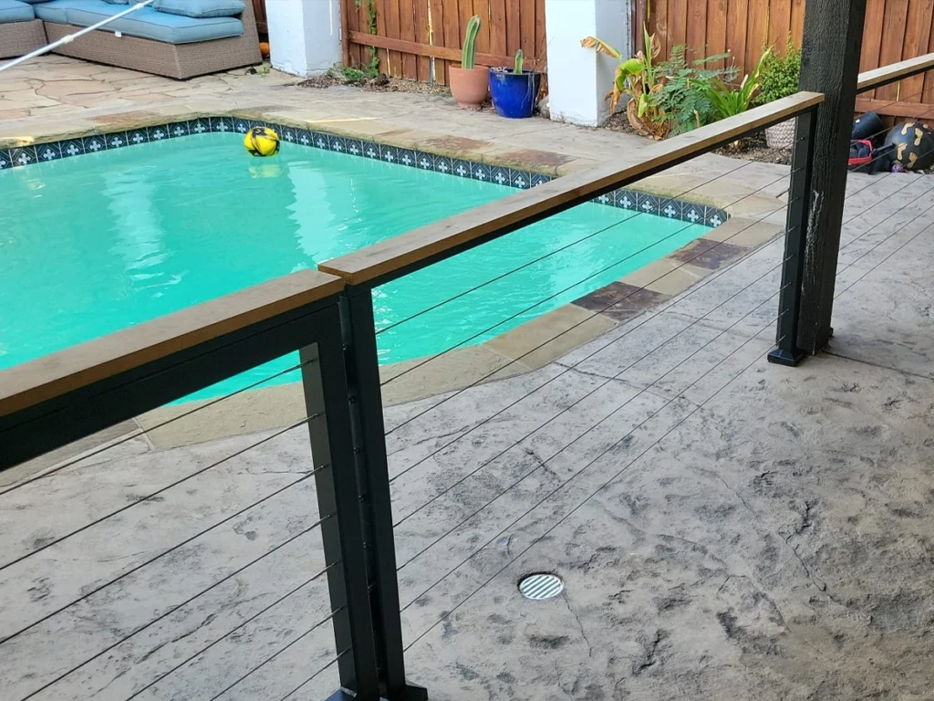 Modern sliding iron gate installed by Everlast Gates & Fence near a residential pool in Plano, TX