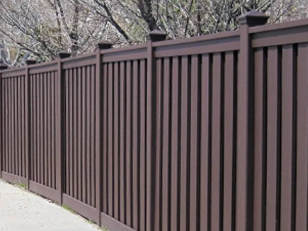 Privacy fences in Frisco installed beside a modern home near a busy residential street