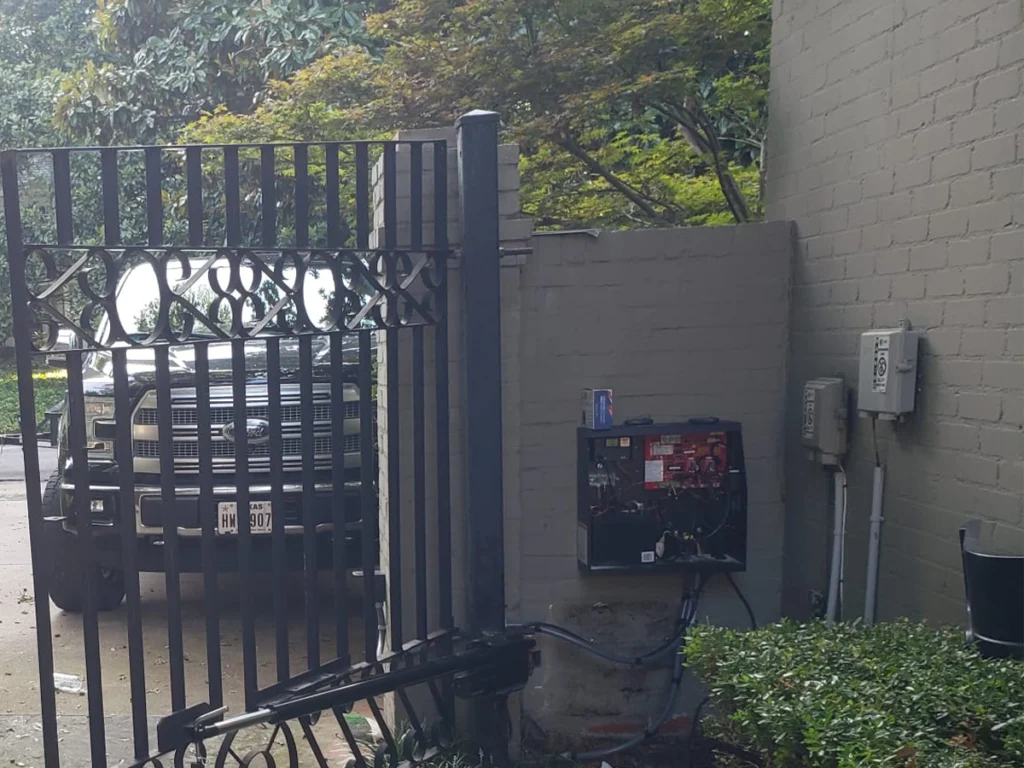 Automatic gate repair expert fixing a driveway gate
