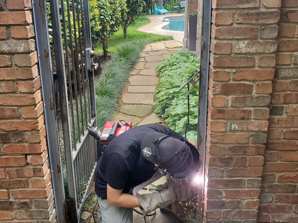 Well-maintained residential gate in Farmers Branch with lush landscaping