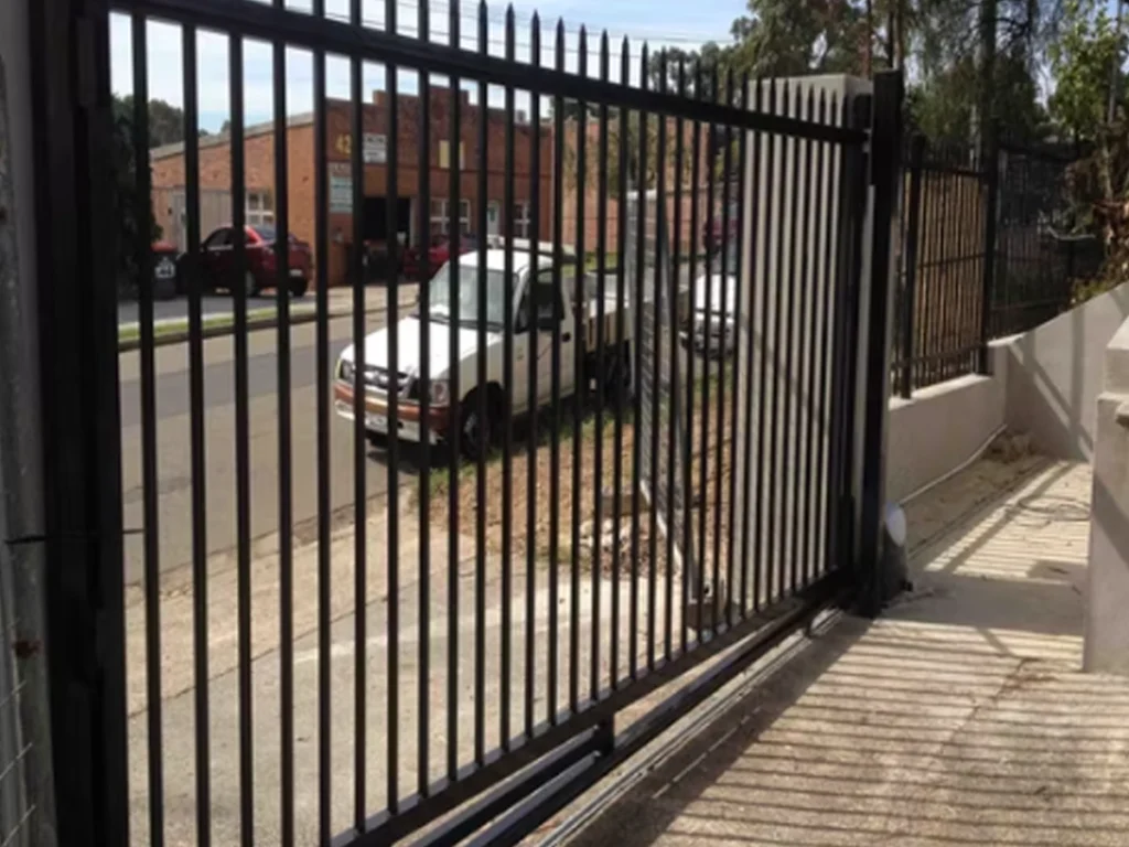 Sliding iron gate North Texas home built for heat and storms