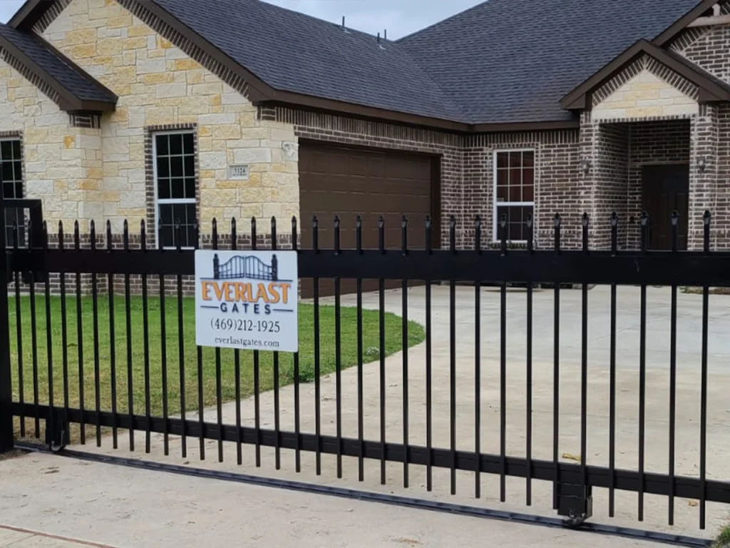Sliding residential gate installation in Houston by Everlast Gates & Fence