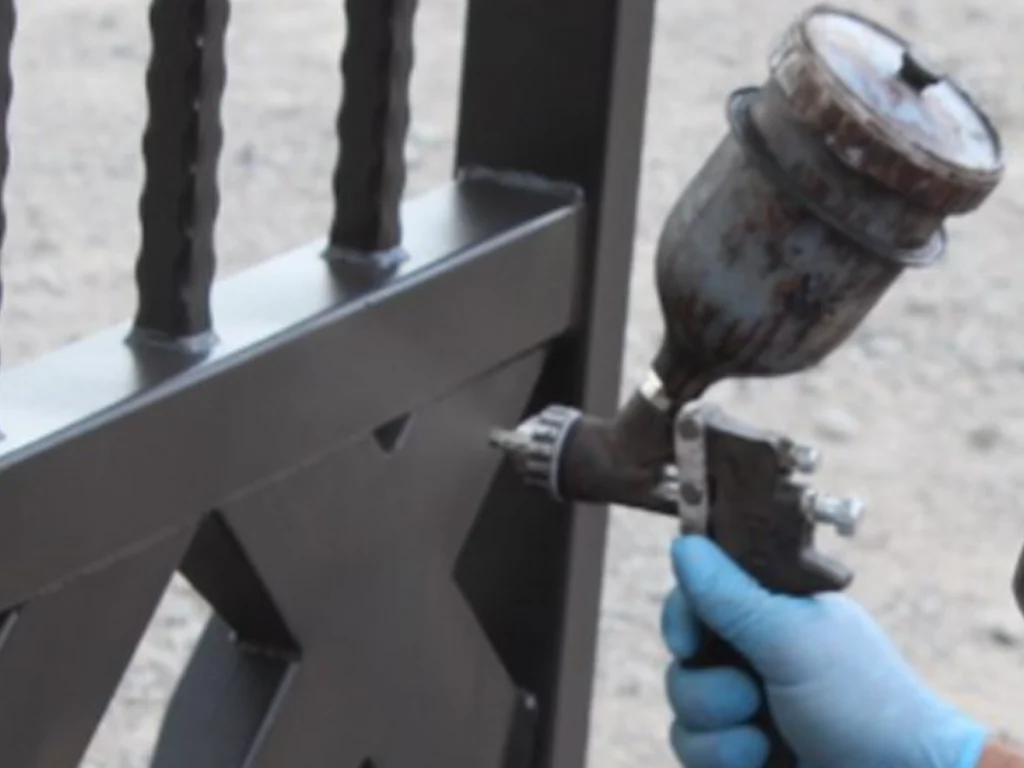 Southlake iron gate rust prevention by checking early rust on an iron driveway gate