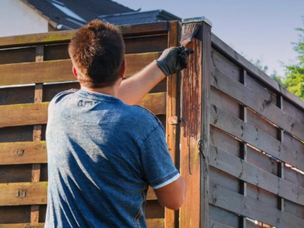 Storm season prep of wood fence in San Antonio backyard