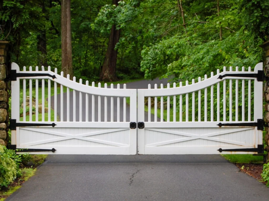 Custom driveway gate combining wood and metal for durability and style