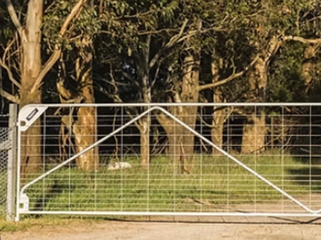 Swing gate installation in Farmers Branch at a welcoming residential driveway