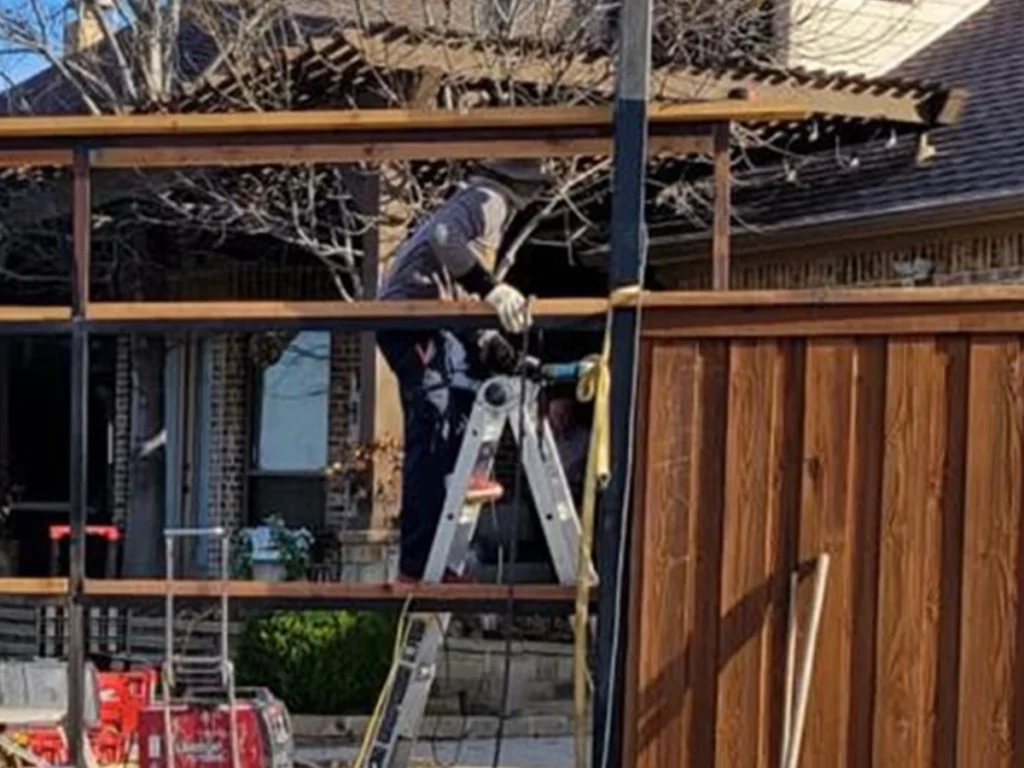 Mold and mildew buildup on a wooden Texas fence due to humidity