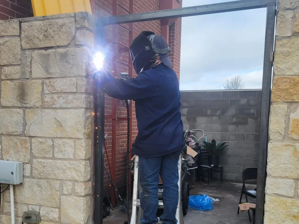 Welding a broken gate in Farmers Branch for a secure and lasting repair.