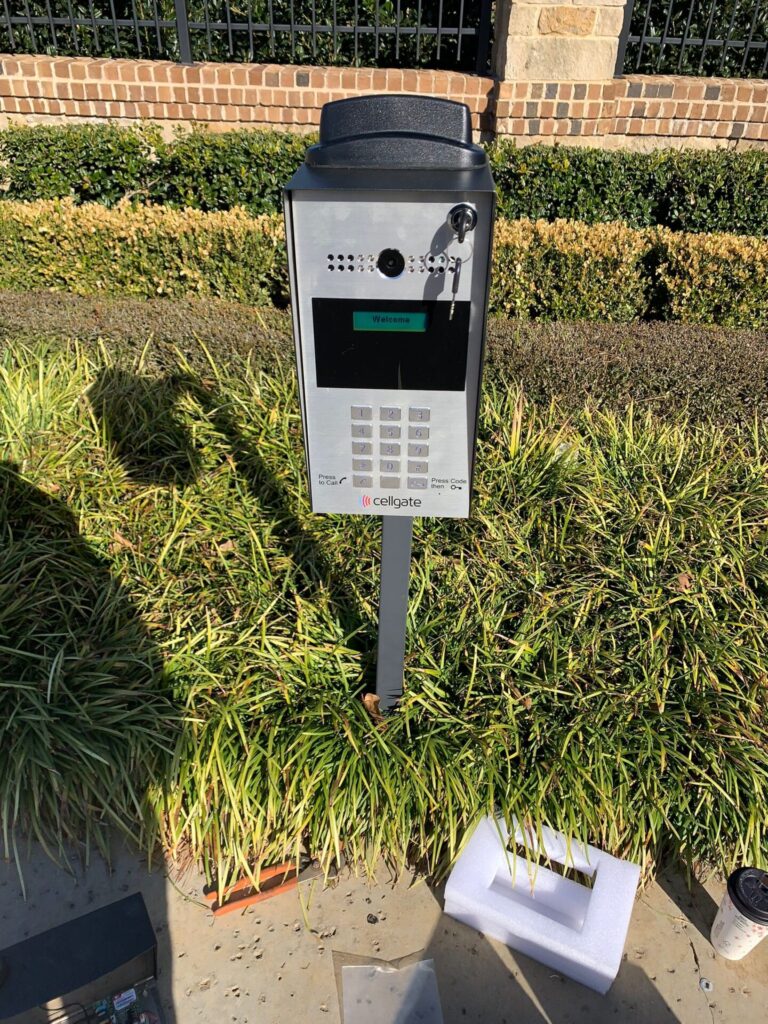 A modern call entry gate system installed at a business entrance.