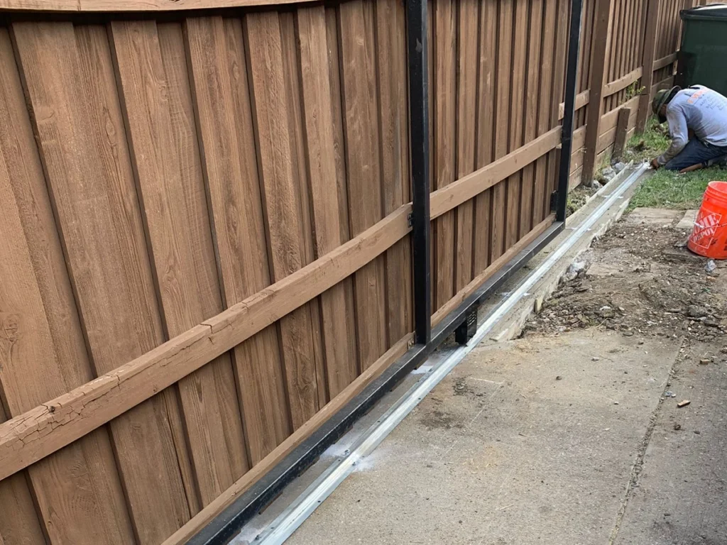 Wood fence installed in a sunny backyard in Farmers Branch, TX.