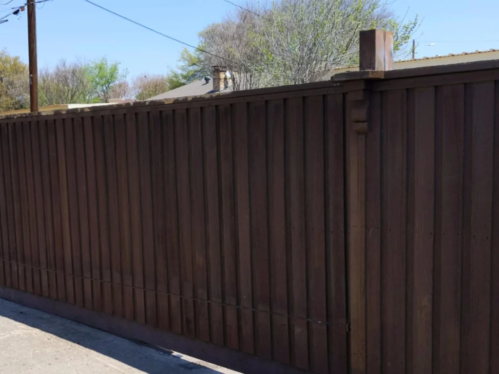 Beautiful wood gate installation in Plano, TX, enhancing curb appeal and security.