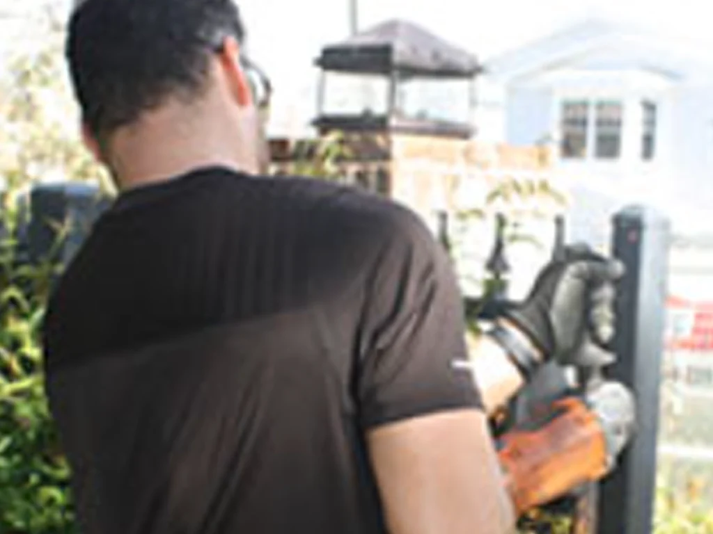 Gate Repair Wylie technician inspecting an automatic driveway gate before an emergency