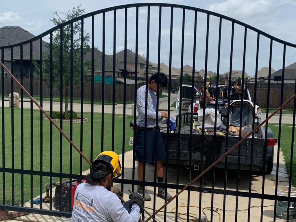 DIY walk-through gate for metal privacy fence installation by Everlast Gates & Fence