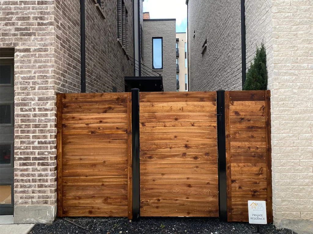 A beautifully crafted wood fence offering privacy and aesthetic charm to a residential property.